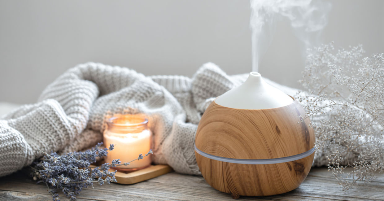 Spa-like setting with diffuser and candles